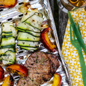 Pork Loin Steaks with grilled nectarins and sheep cheese zucchini rolls