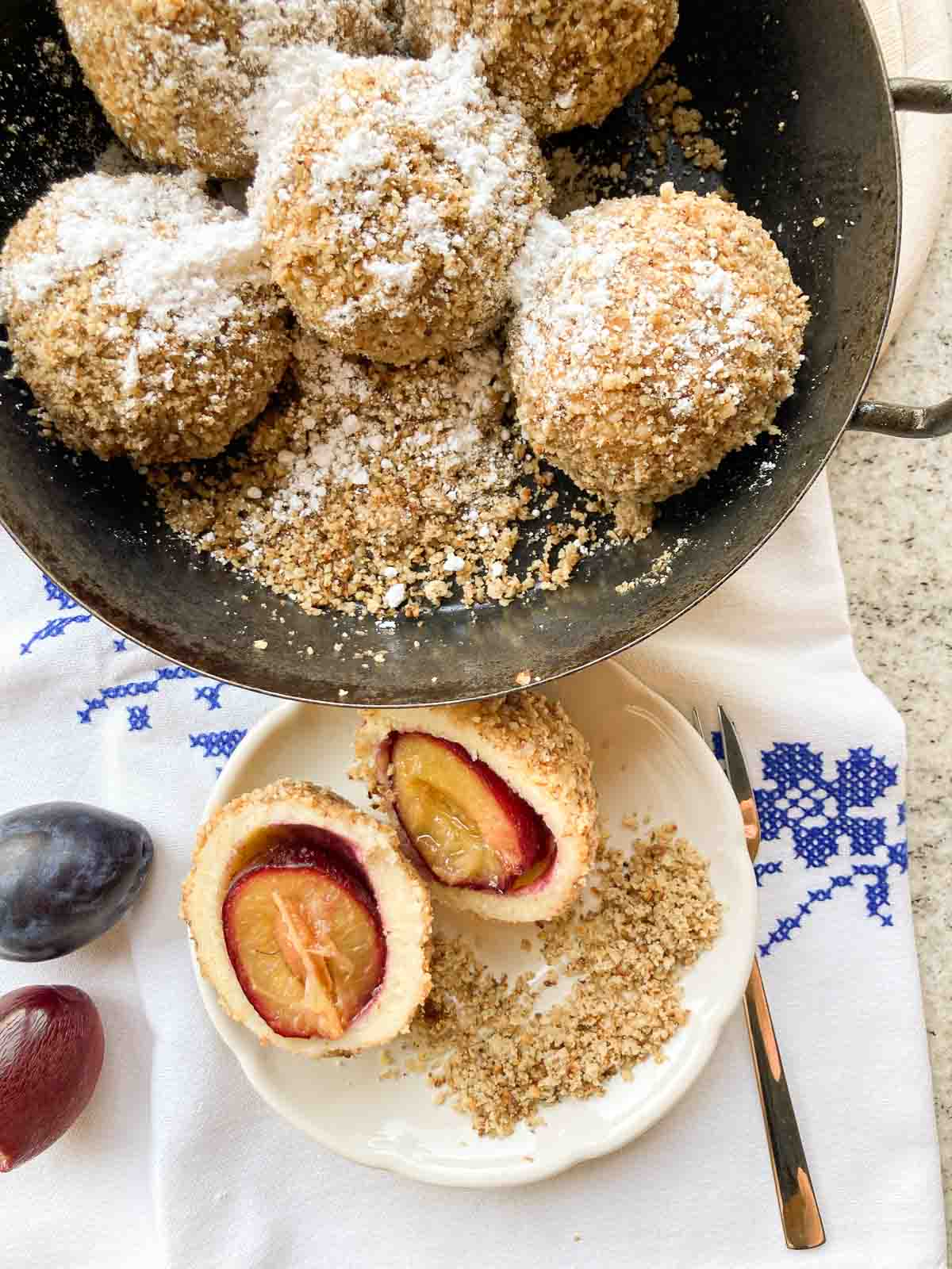 Zwetschkenknödel Brandteig mit Nussbröseln | Traditional Austrian choux pastry dumplings filled with plums and covered in breadcrumbs