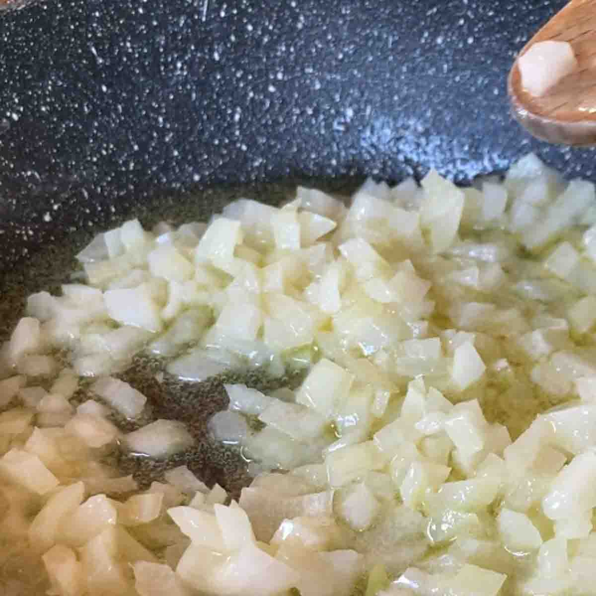 Sautéing onion in butter.